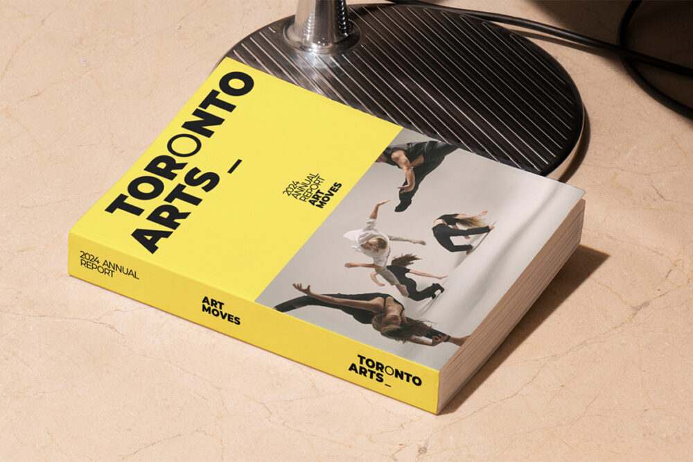A mockup of the 2024 Annual Report lays on the ground