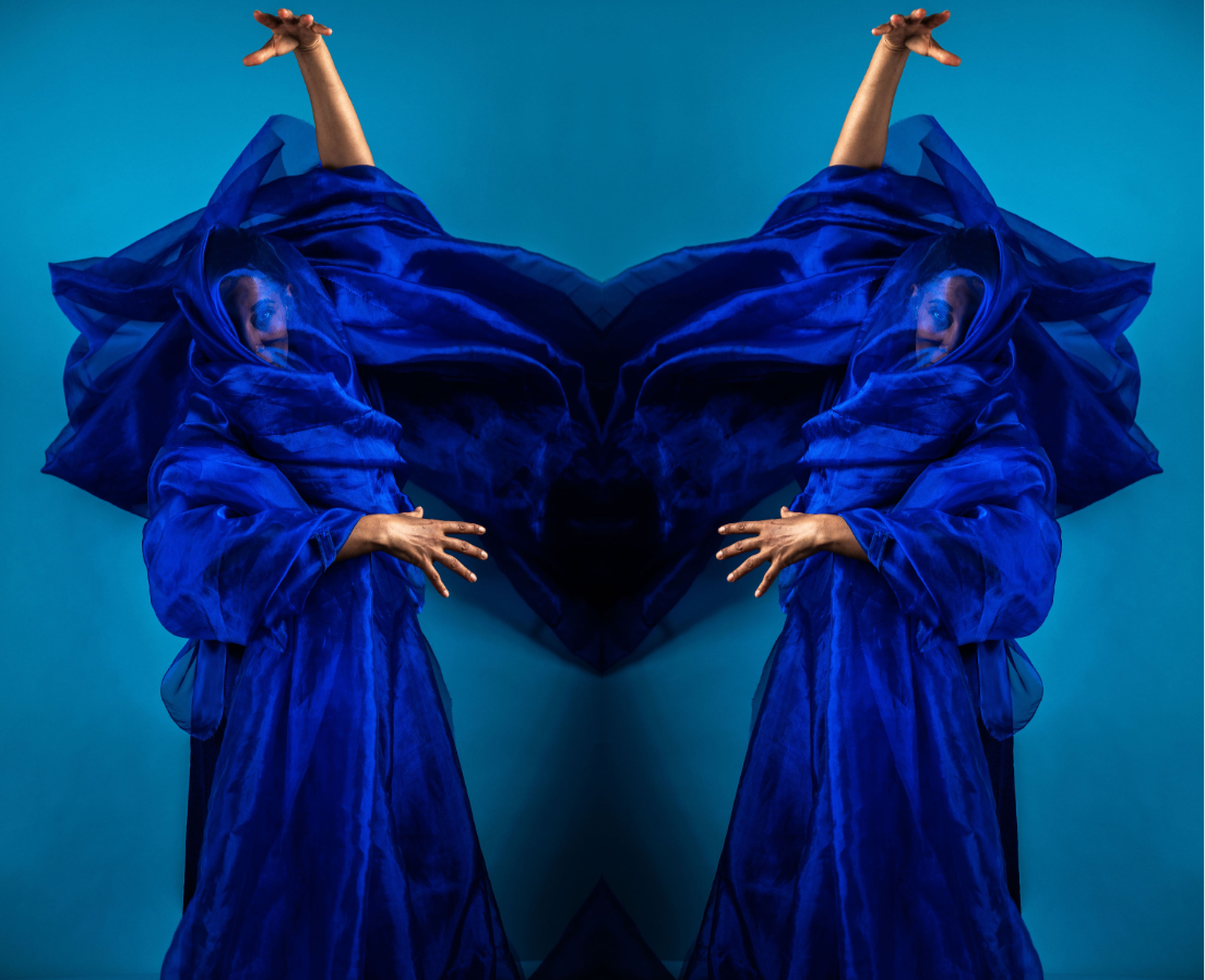 A dancer in blue. The image is mirrored.