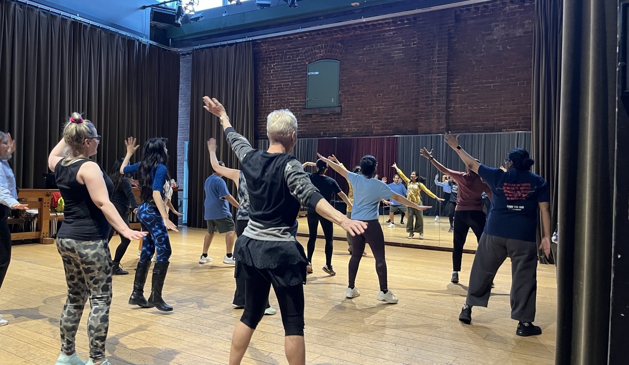 People participate in a Bollywood dance class.