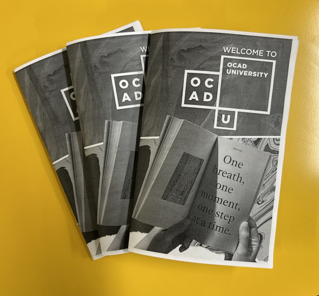 3 booklets of OCAD University kept on a yellow table - says Welcome to OCADU
