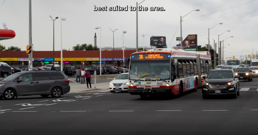 scene of a street in Toronto with the TTC bus number 36 for Finch West - other cars in the traffic with people and shops in the background