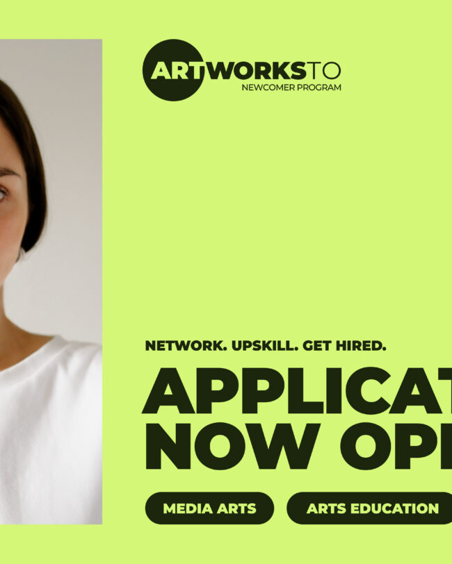 A person looks through a camera lens. Text: Network. Upskill. Get hired. Applications now open.